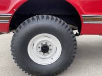Kit designed to center rear tire in wheel well